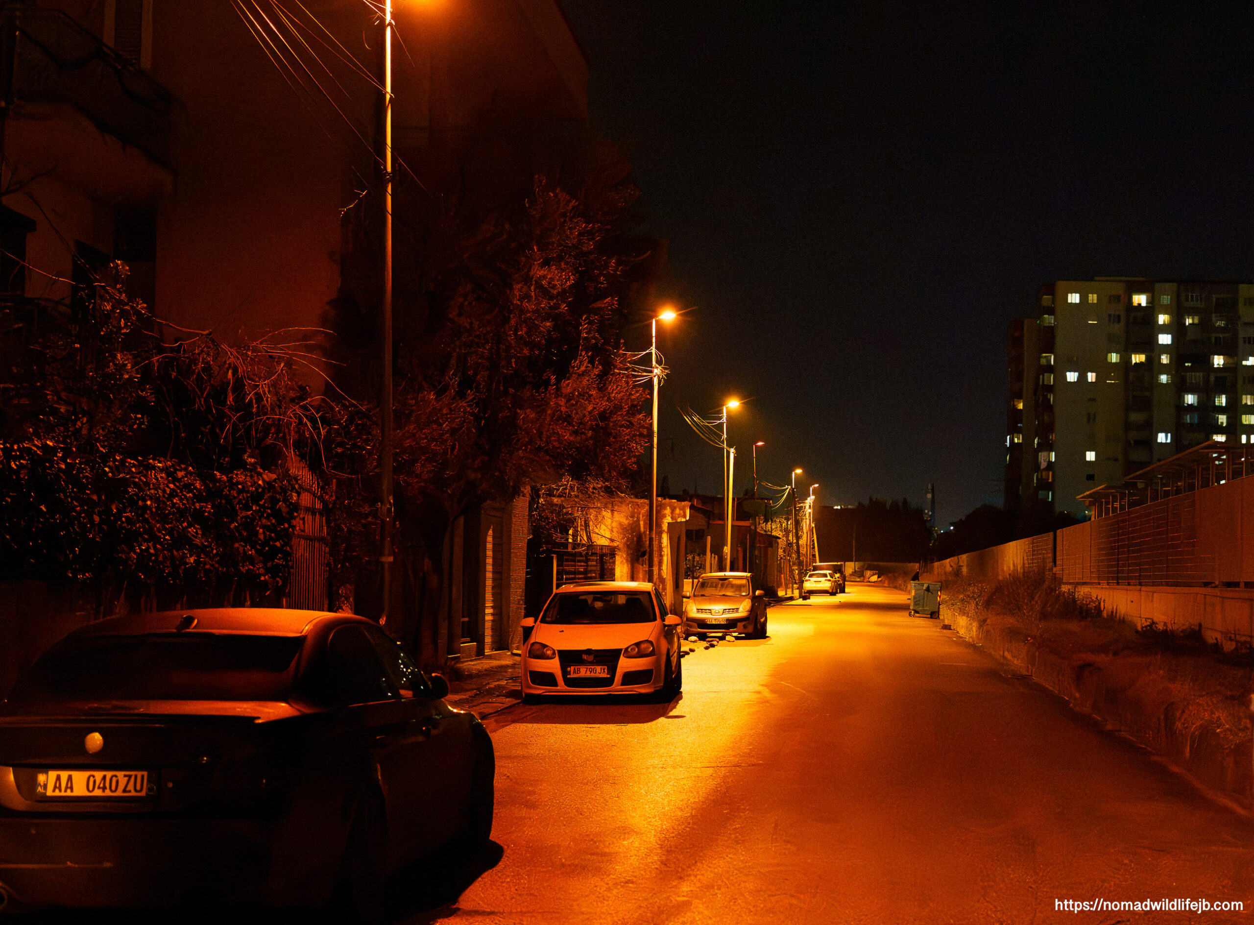 Empty residential street at night in Tirana, Albania.