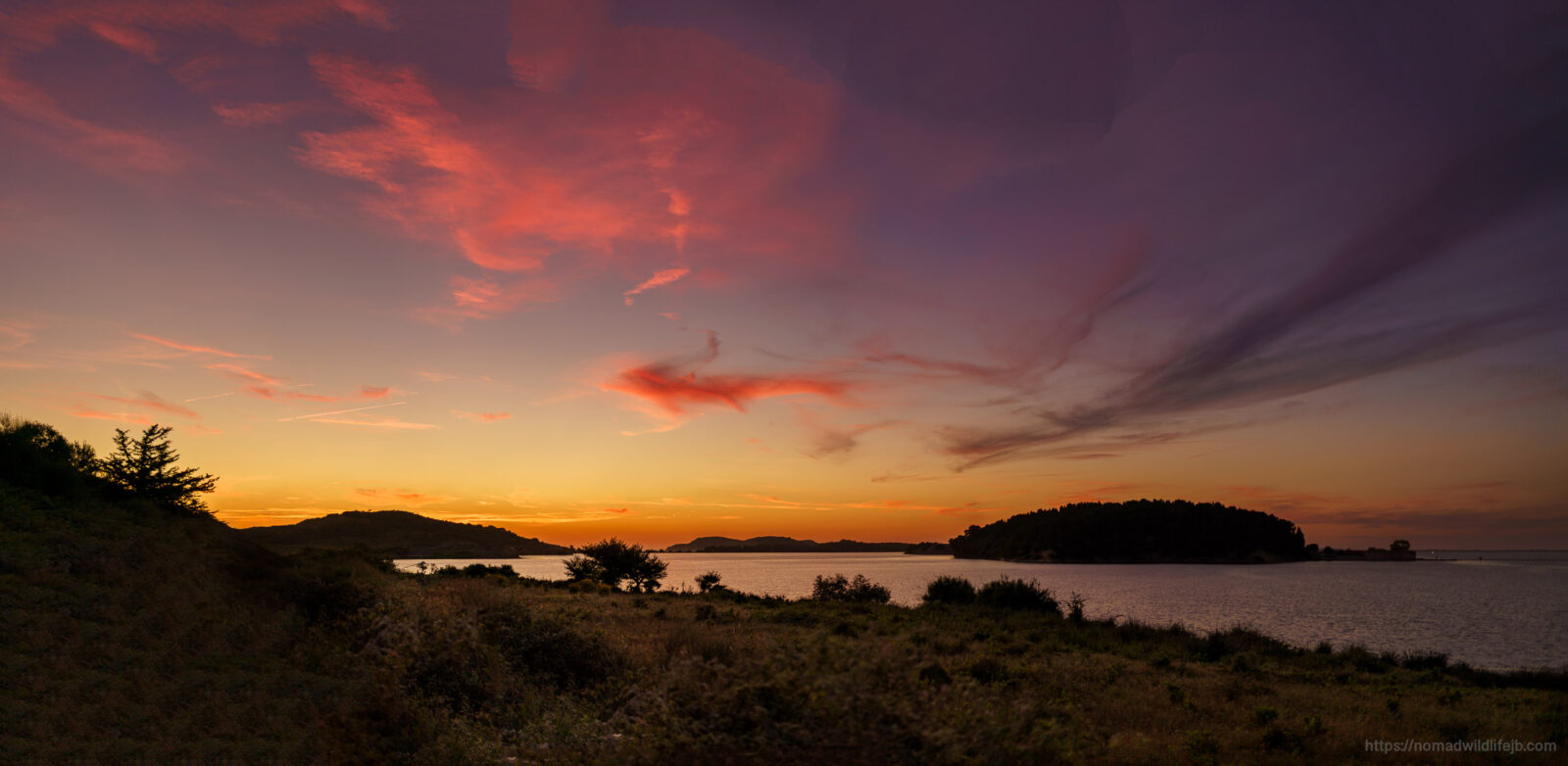 Sunset over the Narta Lagoon and surrounding coastline near Vlorë, Albania.